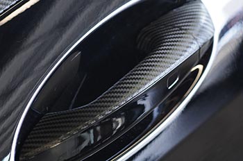 Mercedes door handle wrapped in carbon fiber