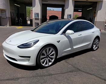 Ceramic window tinting on a white Tesla.