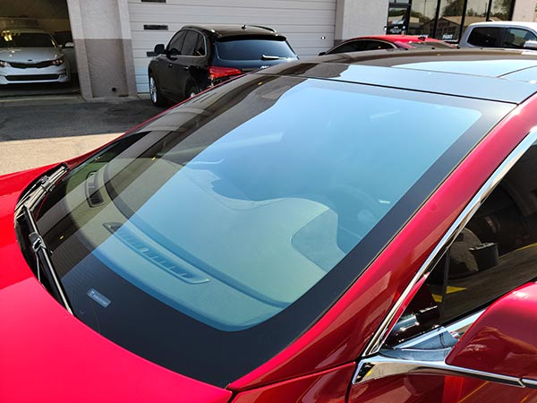 70% CIR windshield tint on red Tesla