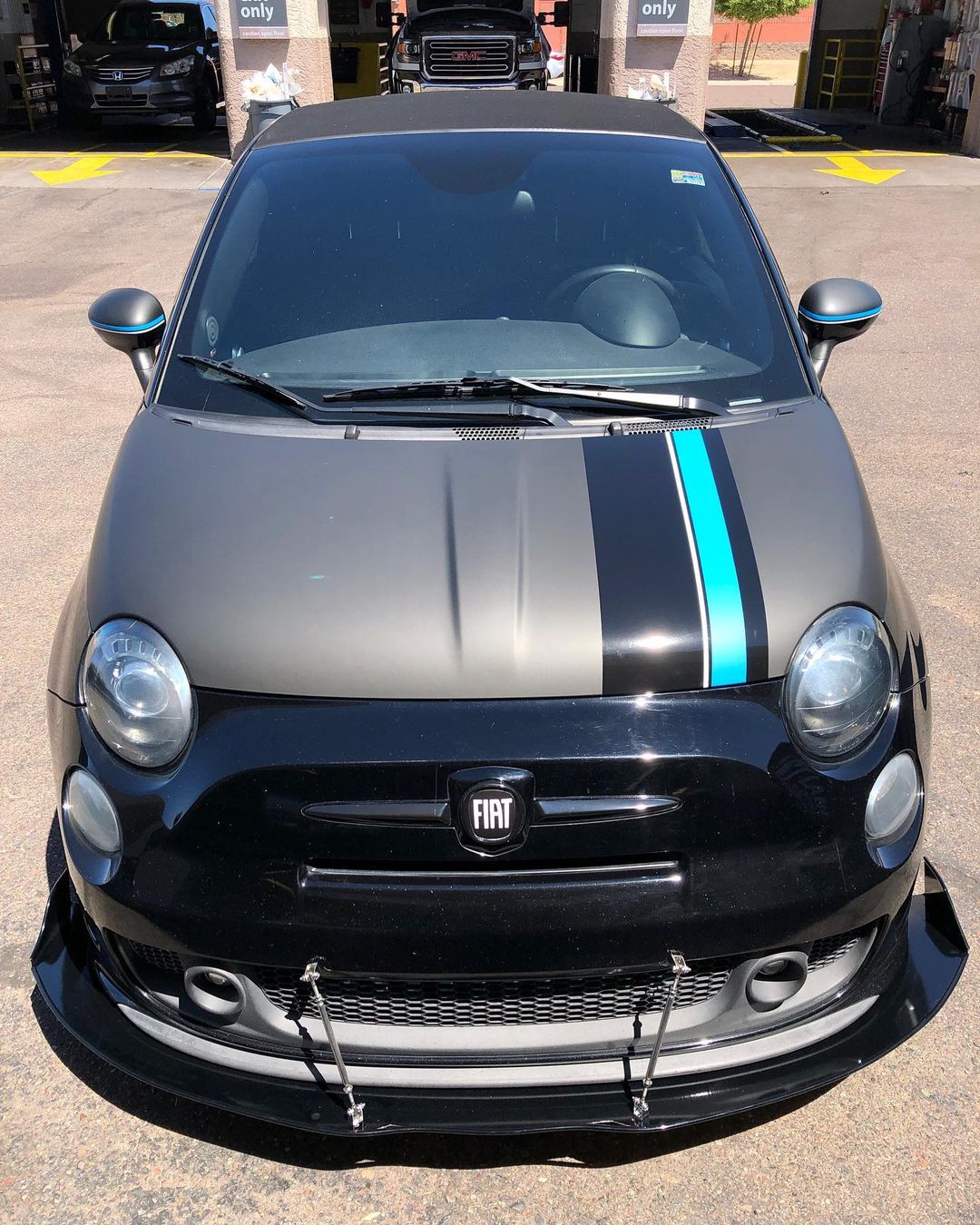 Matte black hood wrap on Fiat Abarth, stripes.