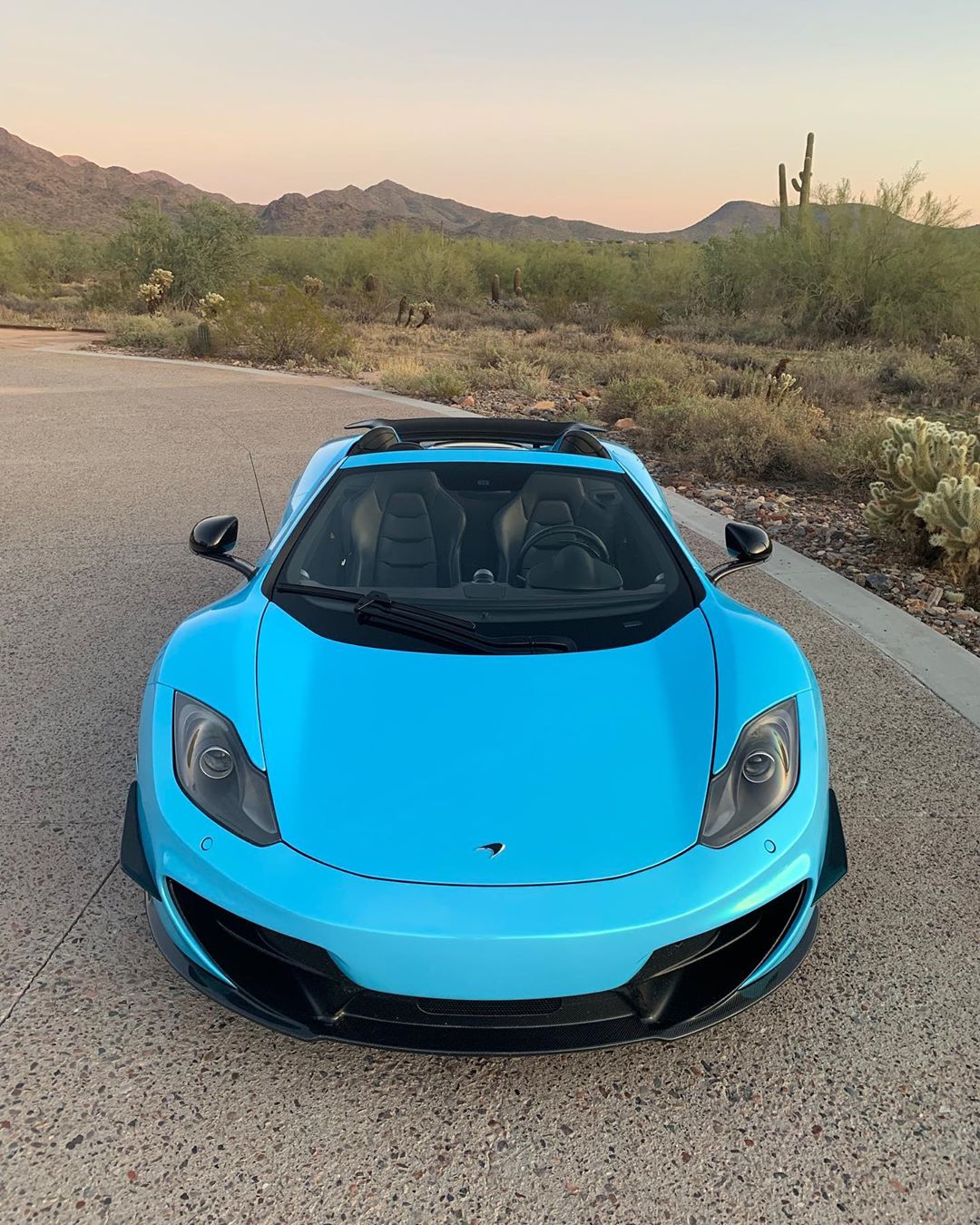 McLaren wrapped in blue, owned by JR Garage 
