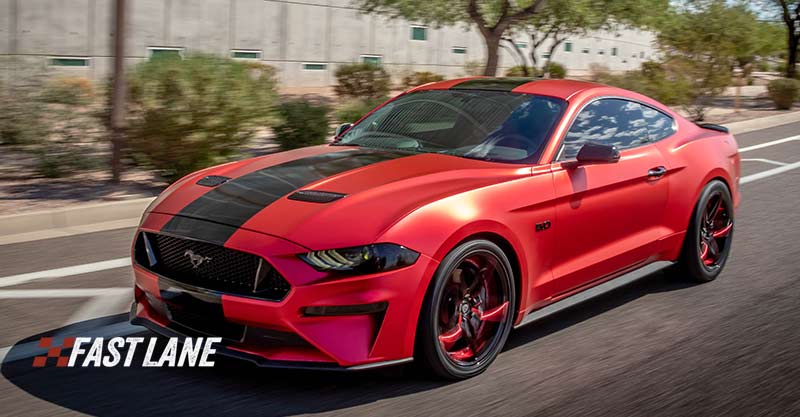 Red matte chrome wrapped Ford Mustang.