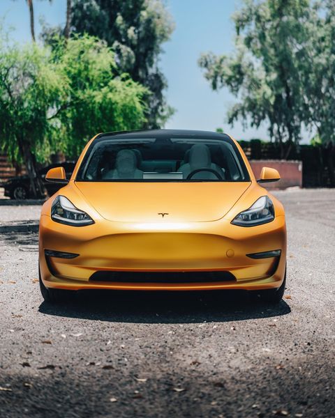 Yellow vinyl wrapped Tesla