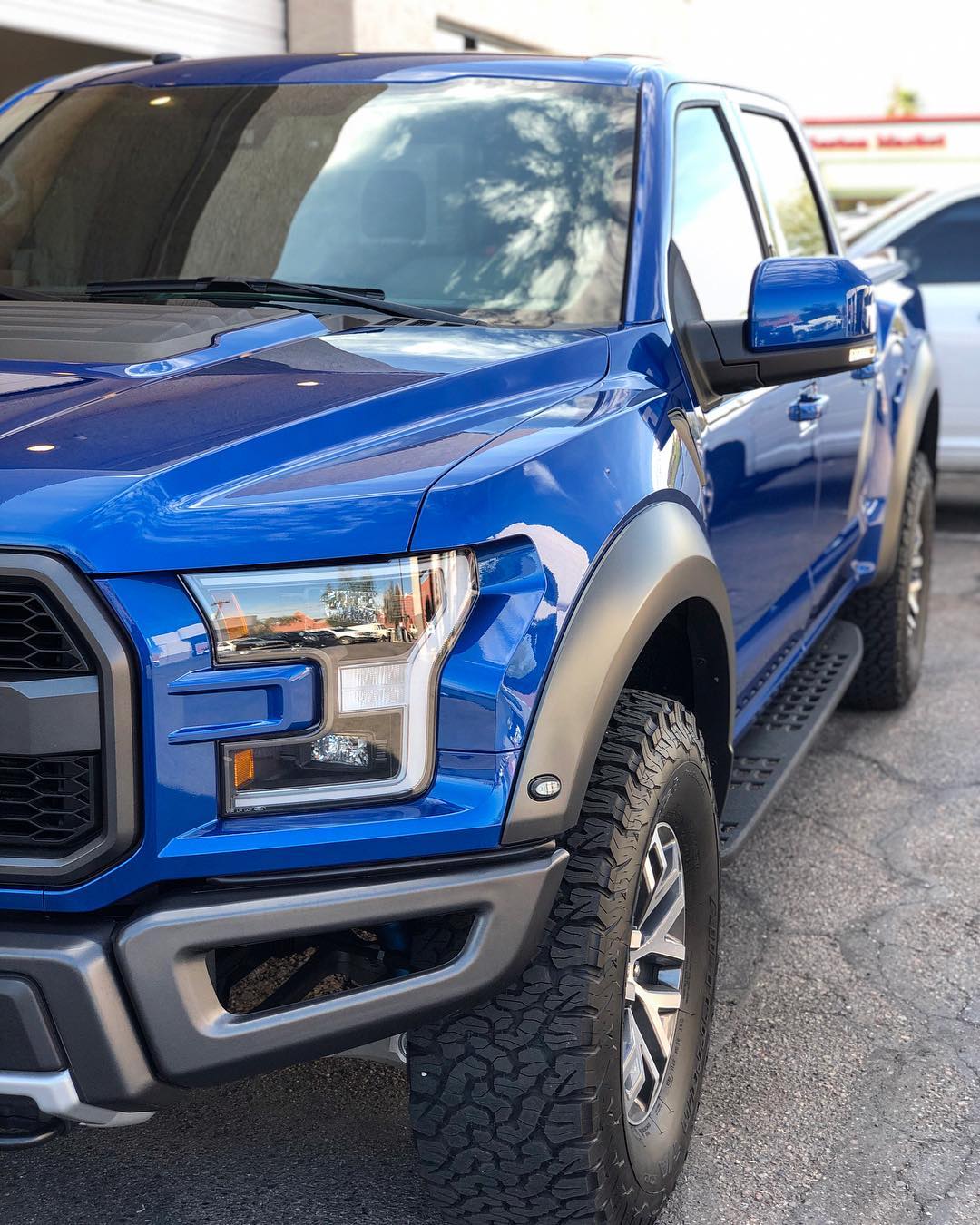 Blue Ford Raptor with tinted windows