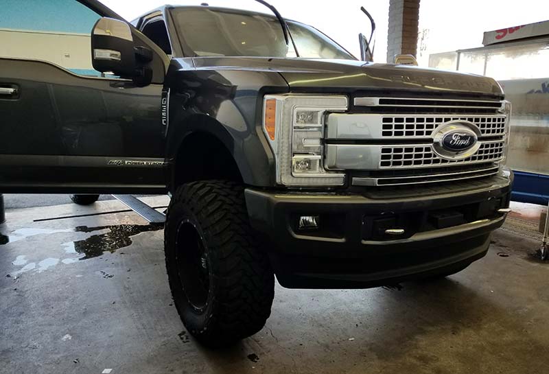 Black F-350 truck window tinting at our Scottsdale shop.