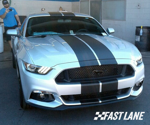 Red Ford Mustang with black vinyl stripe in Scottsdale